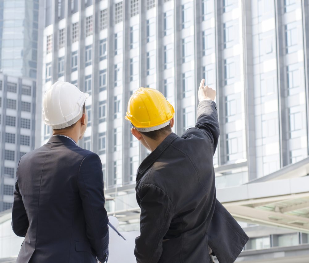 Engineers talk about building project on site